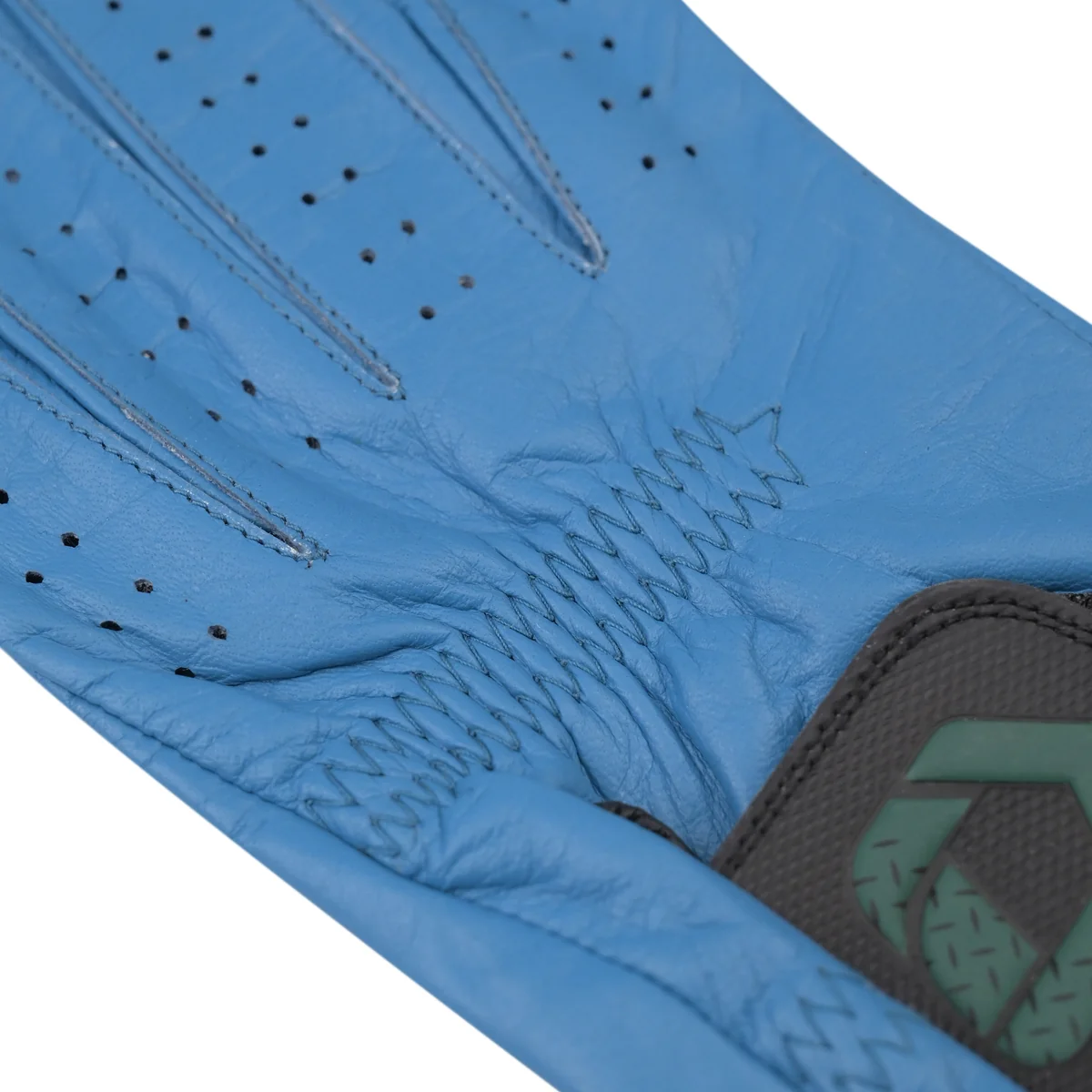 Close-up of blue Cabretta leather, finger seams and elastic back stitching