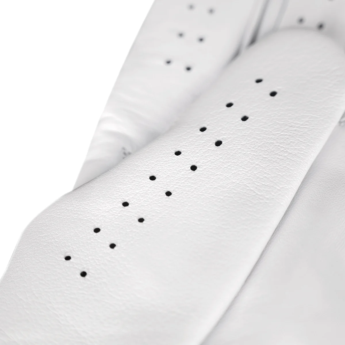Close-up of white Cabretta leather grain and finger perforations